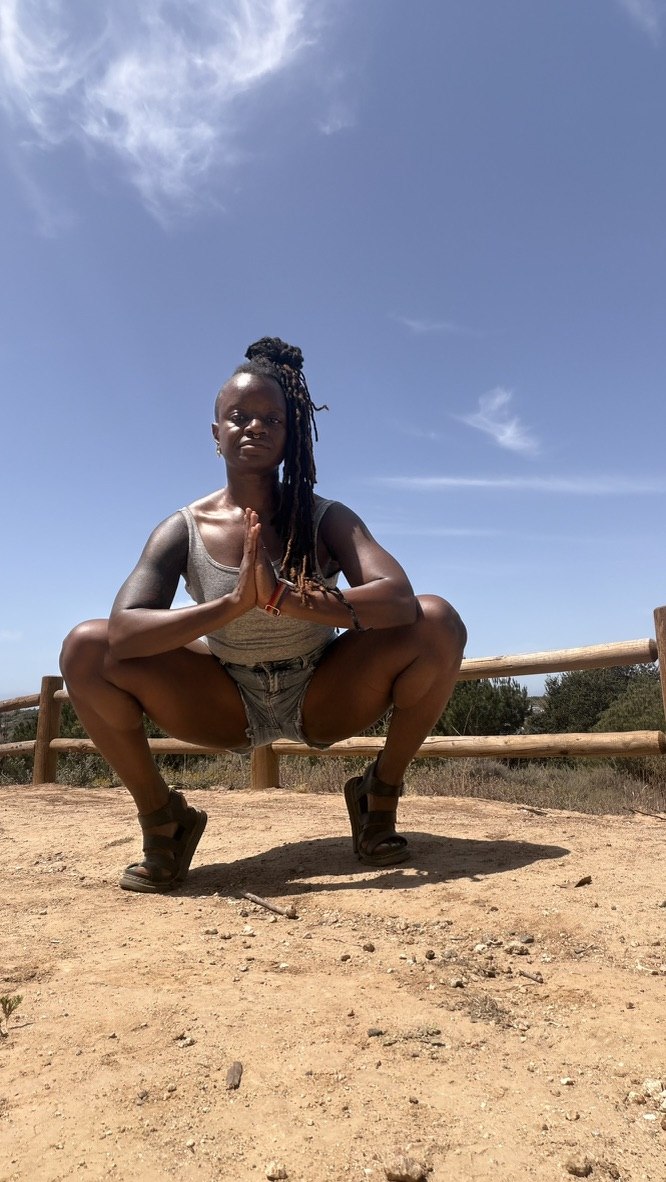 Chinyere Ezie in a yoga pose outdoors